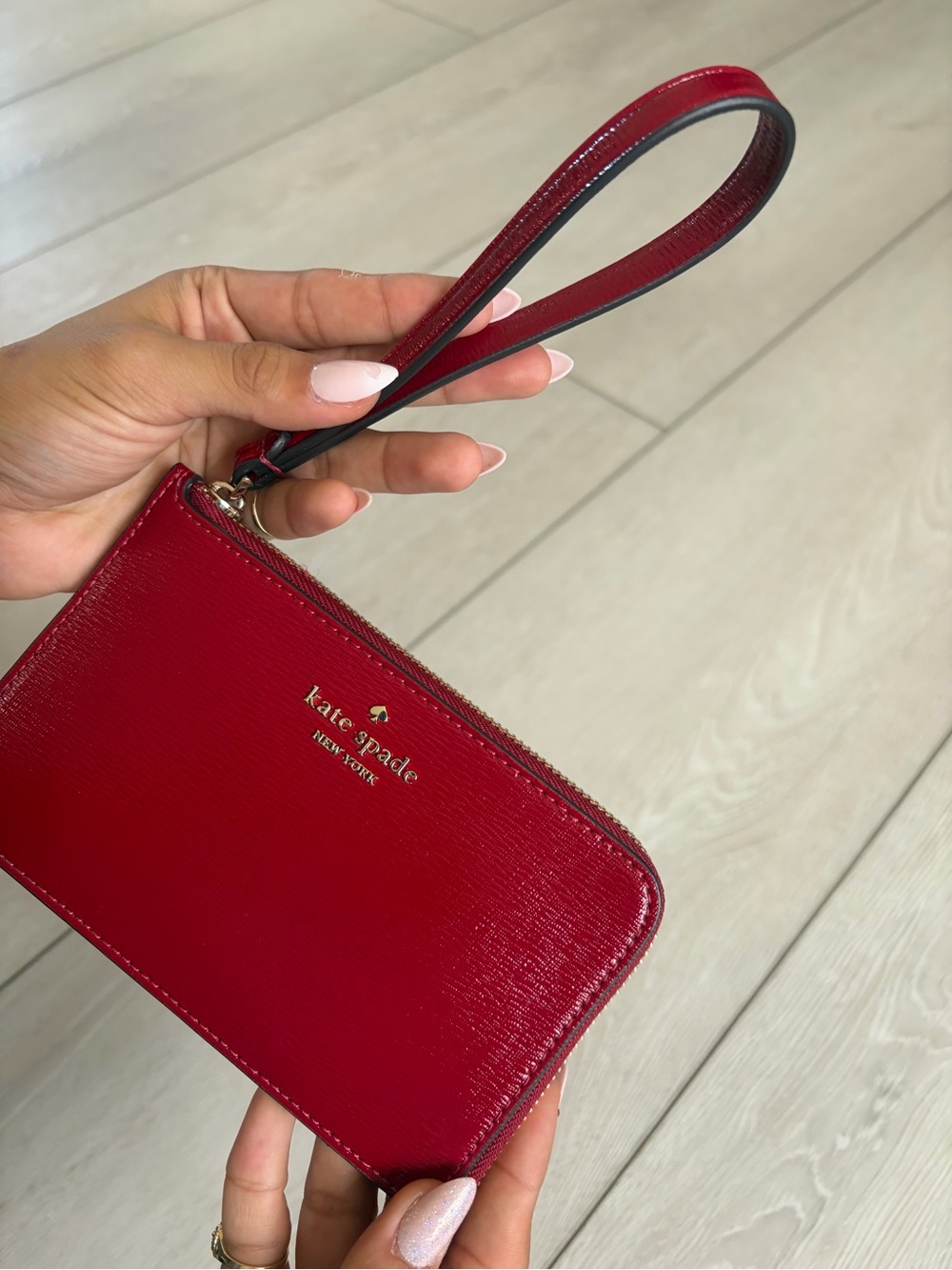 kate spade red patent leather wristlet with gold logo